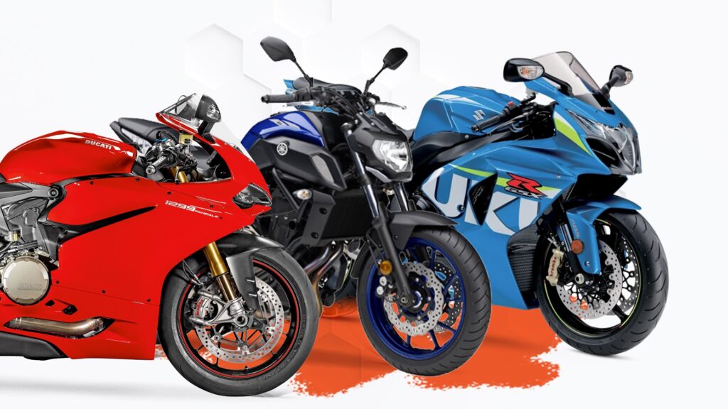 Three high-performance used motorbikes, Ducati, Yamaha, and Suzuki, displayed side by side for buyers in the UAE.