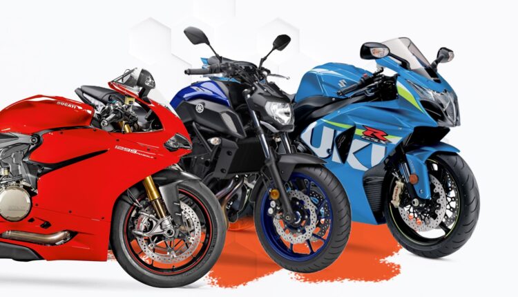Three high-performance used motorbikes, Ducati, Yamaha, and Suzuki, displayed side by side for buyers in the UAE.