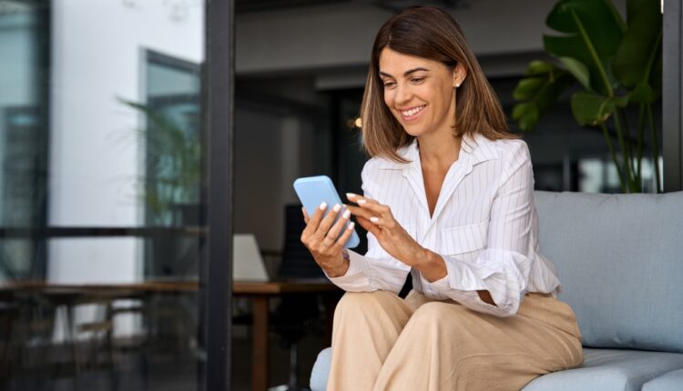 Smartphone screen showing Abu Dhabi taxi booking app interface for online ride-hailing.