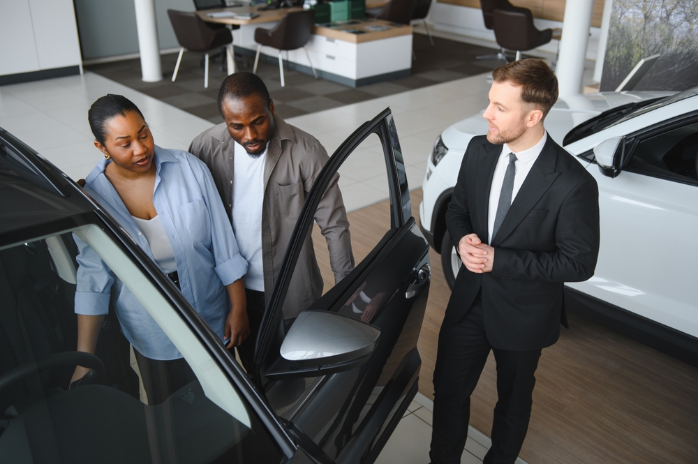 Family comparing electric SUV and sedan for UAE driving needs