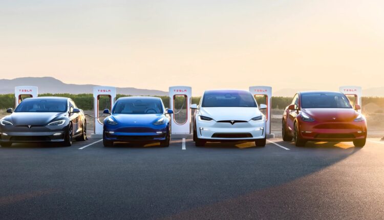Used Tesla cars charging at Superchargers in UAE – Tesla Model 3, Model Y, Model S, and Model X parked under sunset.