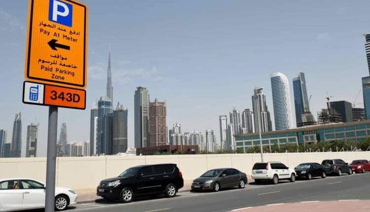 RTA Dubai parking sign with paid and free parking timings.