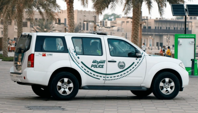 Dubai Police patrol car on city road