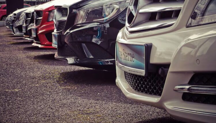 A row of used cars for sale in UAE, highlighting tips for avoiding car scams.