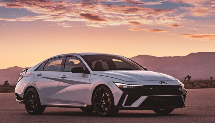 2025 Hyundai Elantra exterior design with angular body lines, LED headlights, and sporty alloy wheels at sunset
