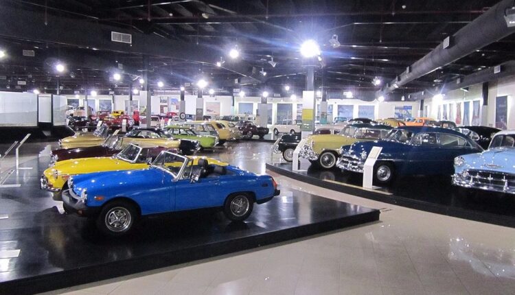 Exhibit of restored classic cars, including convertibles and sedans, at the Sharjah Classic Car Museum in the UAE.