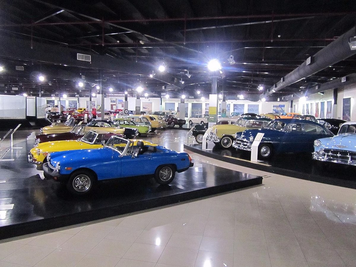 Exhibit of restored classic cars, including convertibles and sedans, at the Sharjah Classic Car Museum in the UAE.