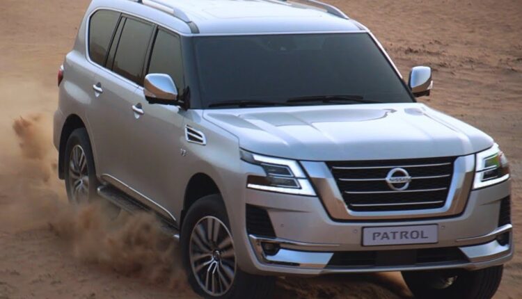 Nissan Patrol driving through desert terrain, showcasing its powerful performance and off-road capability, discussed in the blog 'Living with a Nissan Patrol: Is it a Practical Daily Driver for the City?