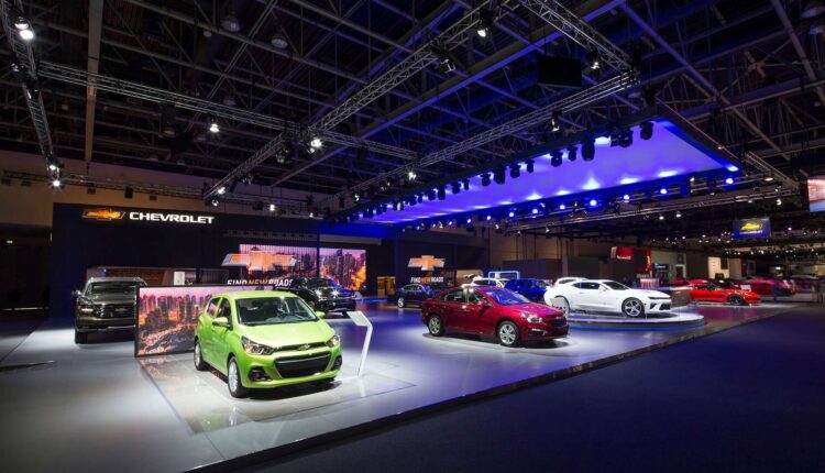 Chevrolet exhibition booth at Dubai Motor Show 2025 displaying multiple new-generation models and electric vehicles on stage at Dubai World Trade Centre.
