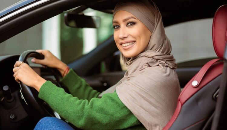 Emirati woman driver enjoying freedom on Dubai roads, representing Women Behind the Wheel UAE and the growing empowerment of female drivers.