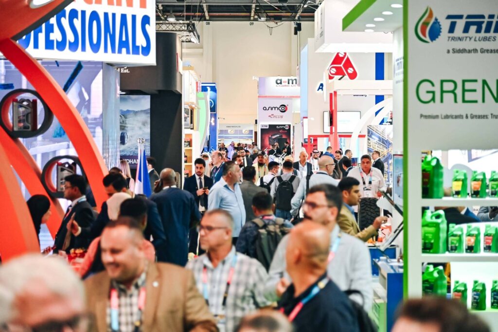 Visitors networking and exploring automotive products at Automechanika Dubai, showcasing the dynamic and diverse environment of the trade show.