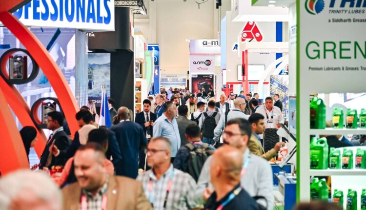 Visitors networking and exploring automotive products at Automechanika Dubai, showcasing the dynamic and diverse environment of the trade show.