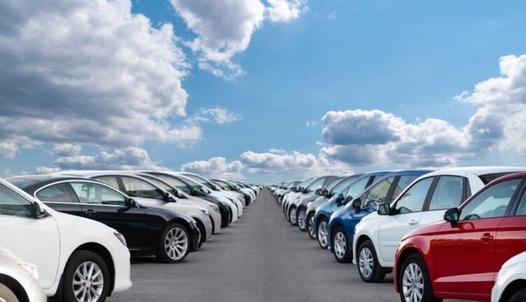 Buying a Used Car Safely: A row of cars for sale in a parking lot, showcasing various makes and models of vehicles in the UAE.