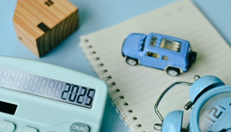 Car loan calculator UAE with toy car, calculator, and financial planning concept to estimate EMI and save money