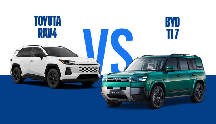A side-by-side automotive comparison graphic titled "TOYOTA RAV4 VS BYD TI 7" in bold blue and white text over a split white and blue background. On the left sits a white, modern Toyota RAV4 concept variant with aggressive blacked-out wheels and front grille trim. Facing it on the right is a boxy, rugged, emerald green BYD Ti 7 plug-in hybrid SUV featuring prominent geometric LED lighting and a muscular off-road stance.|Arabwheels.ae