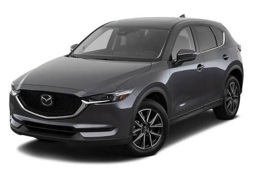 Front three-quarter view of a dark gray 2021 Mazda CX-5 compact SUV on a white background.|Arabwheels.ae