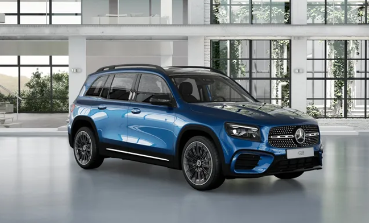 Blue Mercedes-Benz GLB 200 SUV shown from a front three-quarter angle inside a bright, modern showroom.|Arabwheels.ae
