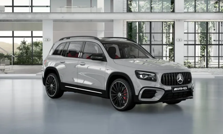 Mercedes-AMG GLB 35 4MATIC in silver displayed inside a bright, modern showroom.|Arabwheels.ae