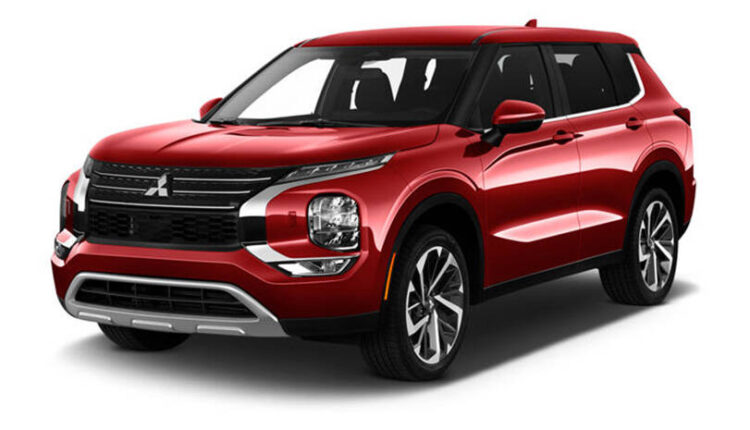 Red Mitsubishi Outlander SUV, highlighting the model that saw UAE sales rise 125% while the overall auto market declined.|Arabwheels.ae