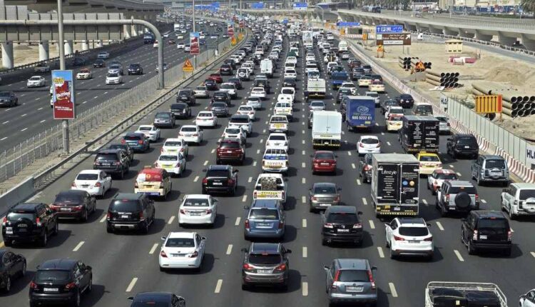 Heavy traffic on a multi-lane Dubai highway illustrating phantom traffic jams in the UAE.|Arabwheels.ae