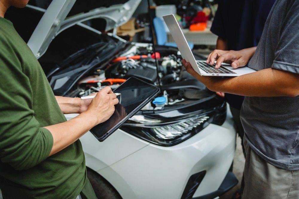 Used car undergoing an inspection before valuation as sellers assess resale value during the UAE new-car price war.|Araabwheels.ae