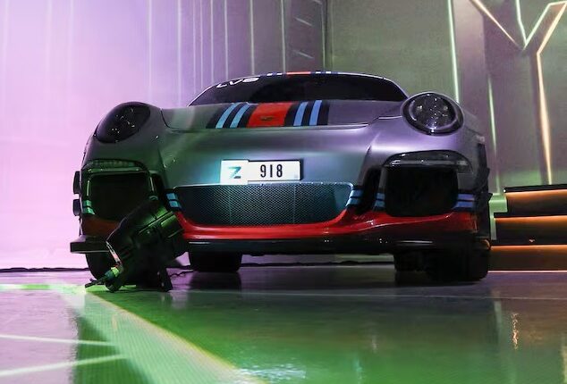 Luxury sports car with a distinctive Dubai number plate at an automotive event|Arabwheels.ae